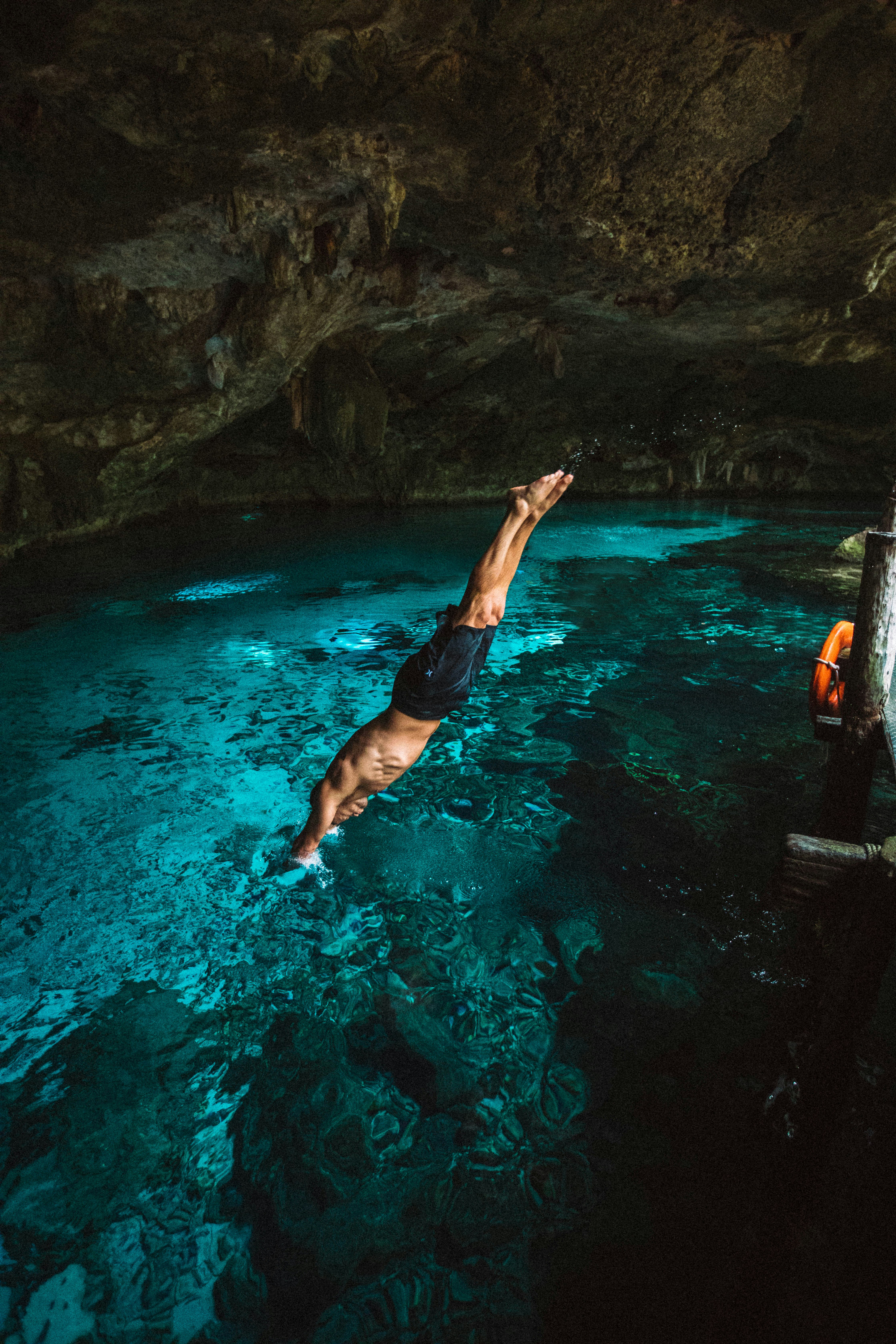 man diving in water